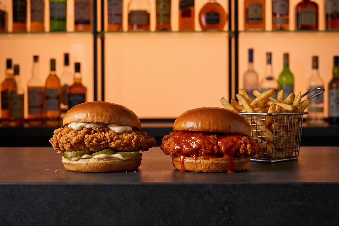 Fried chicken and buffalo chicken sandwiches with fries